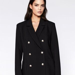 On trend!  Black oversized blazer with standout style